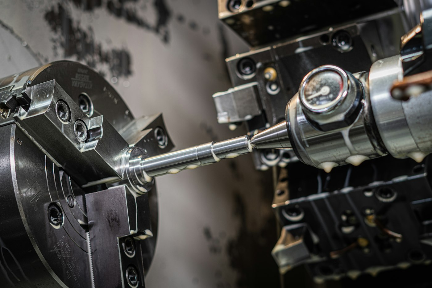 A CNC lathe machining a metal shaft