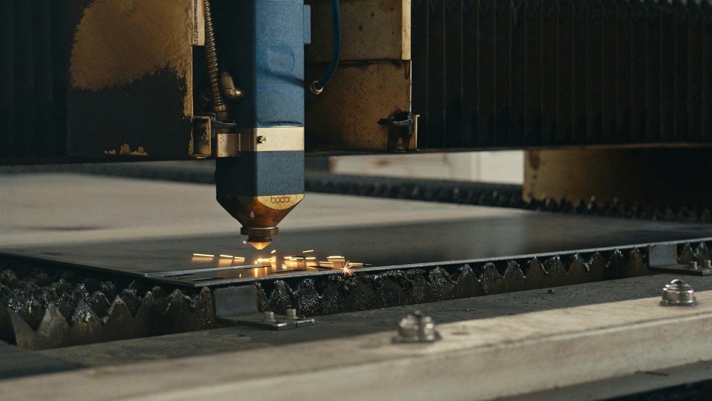 A laser cutter cutting through sheet metal